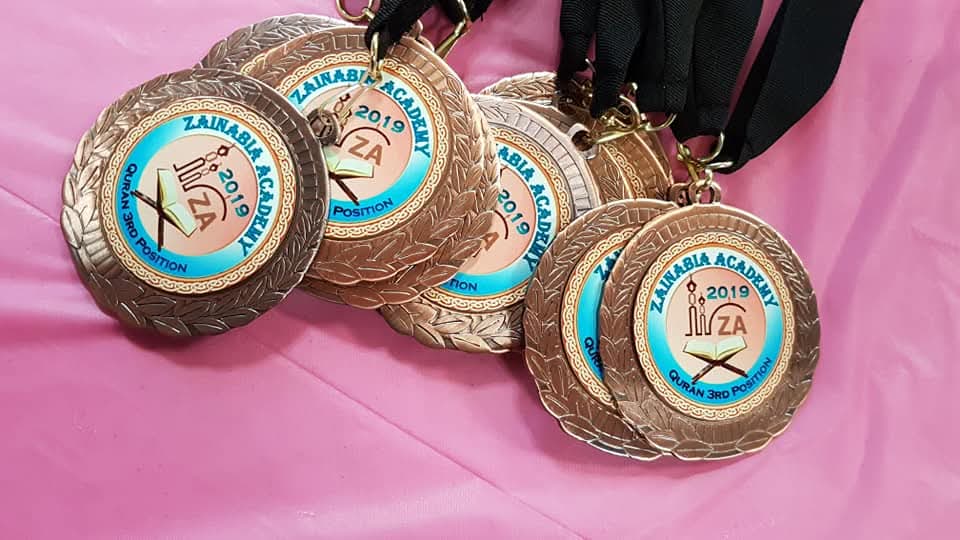 Zainabia Academy Quran position medals laid out before the awards ceremony